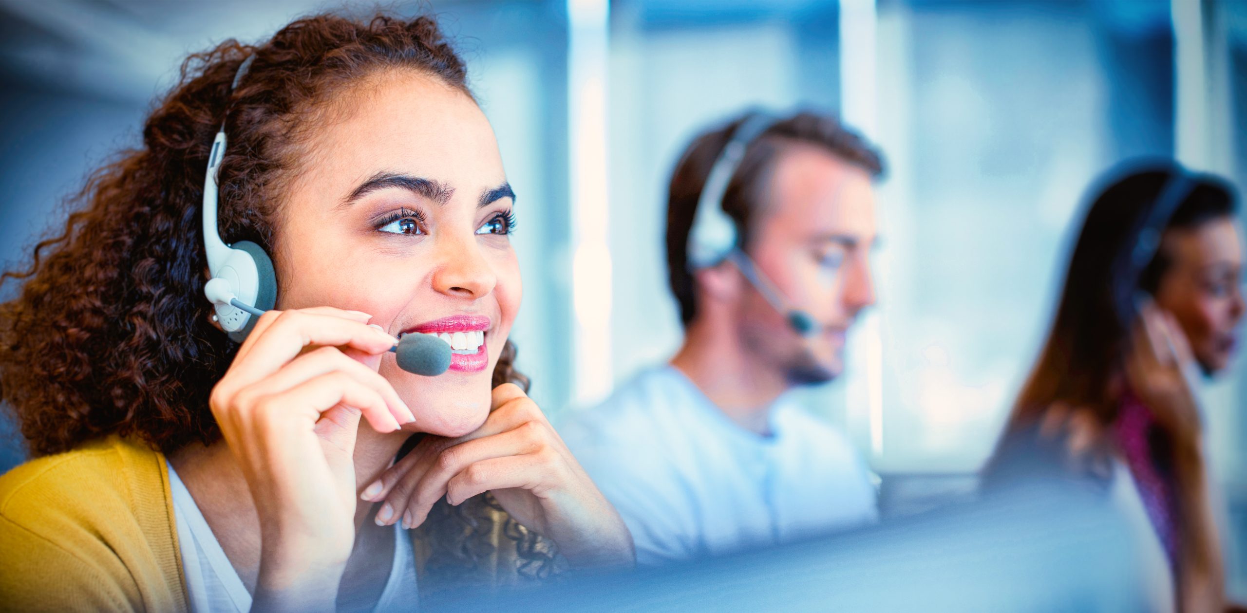 Young lady talking on a headset smiling