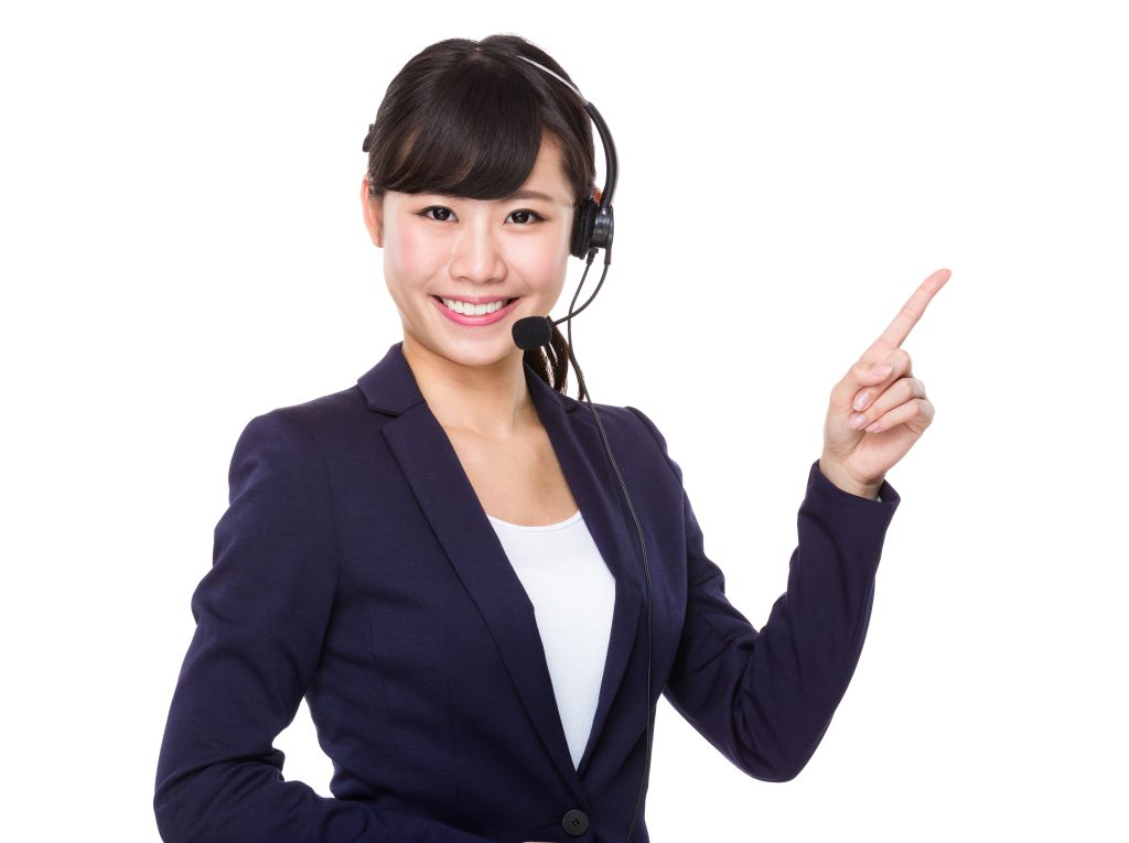 Happy woman wearing a suit and a headset