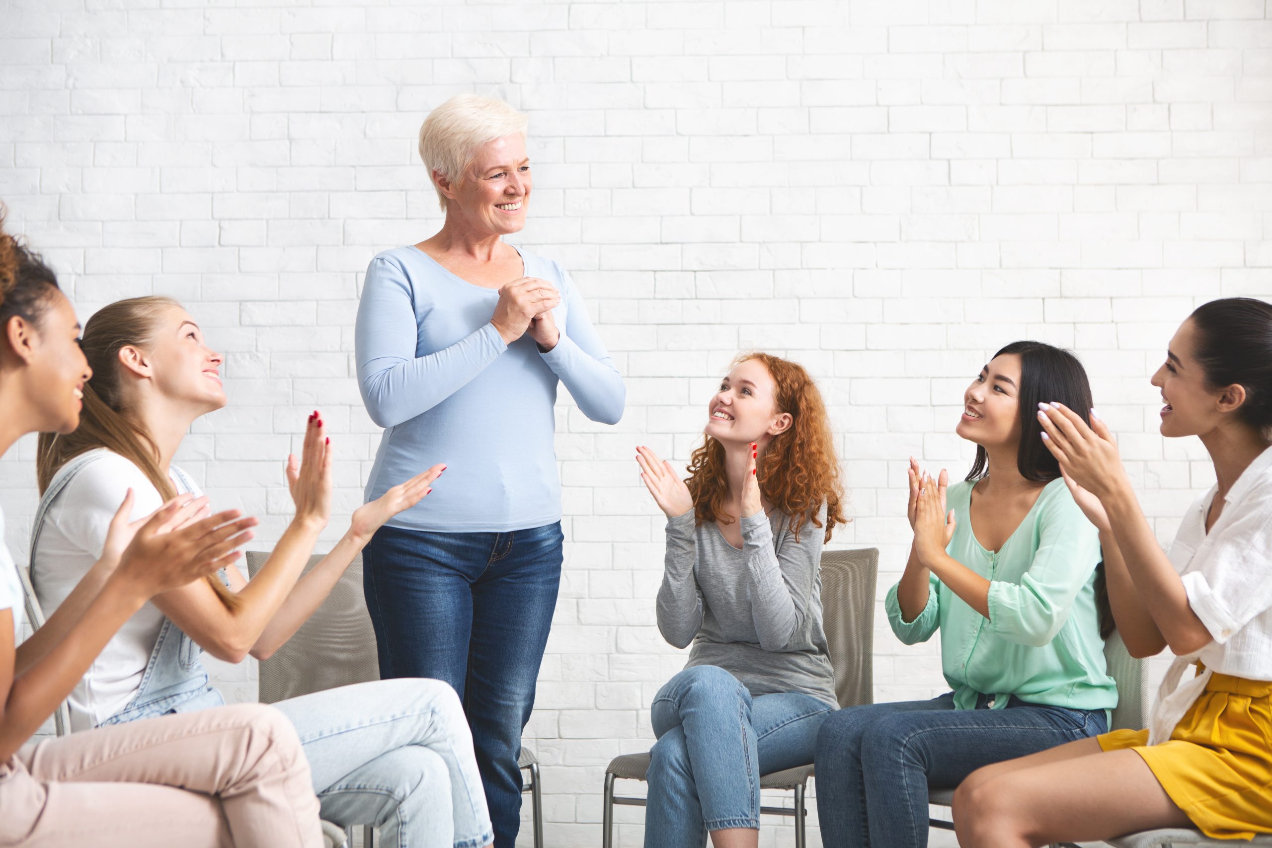 Group Psychotherapy Concept. Mature Woman Expressing Gratitude For Psychological Help And Support During Group Therapy Indoors. Selective Focus