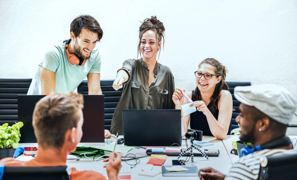 group at work happily engaging in discussion